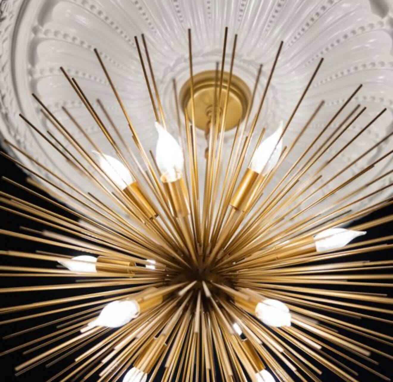 Elegant chandelier detail in The Coach House